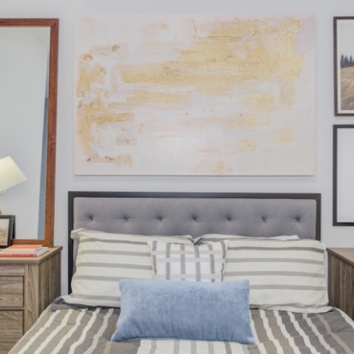 interior photo of a bedroom with bed and nightstands